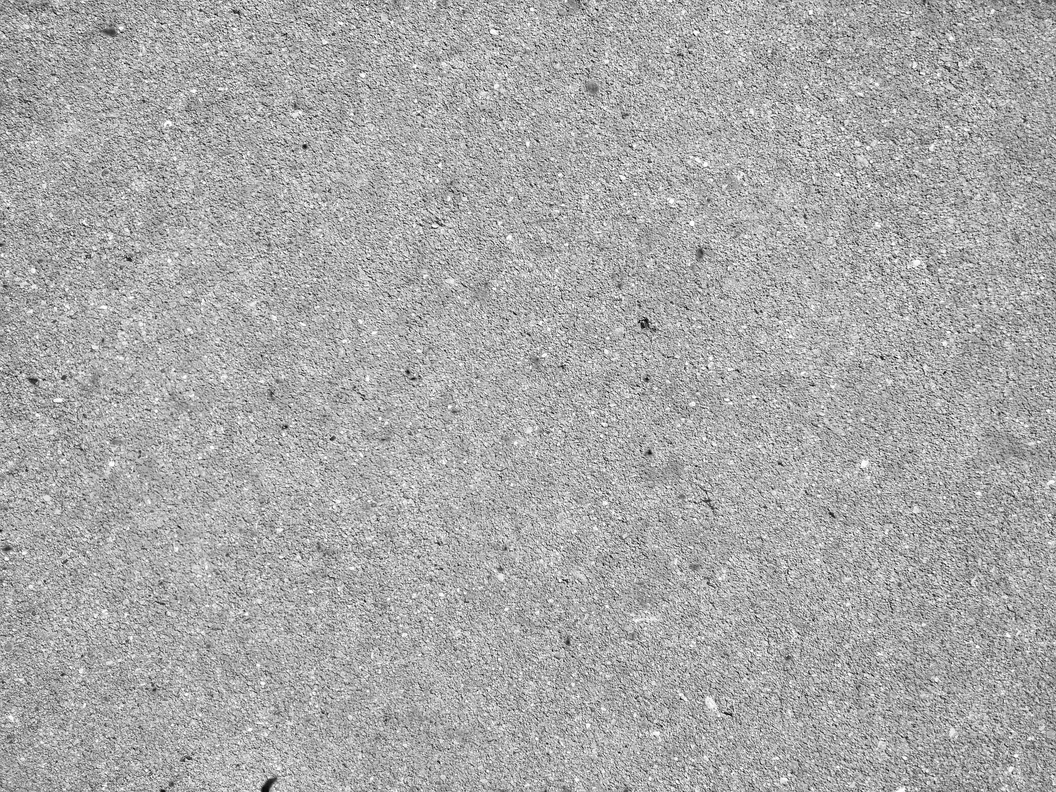 Grey grainy textured asphalt closeup photo